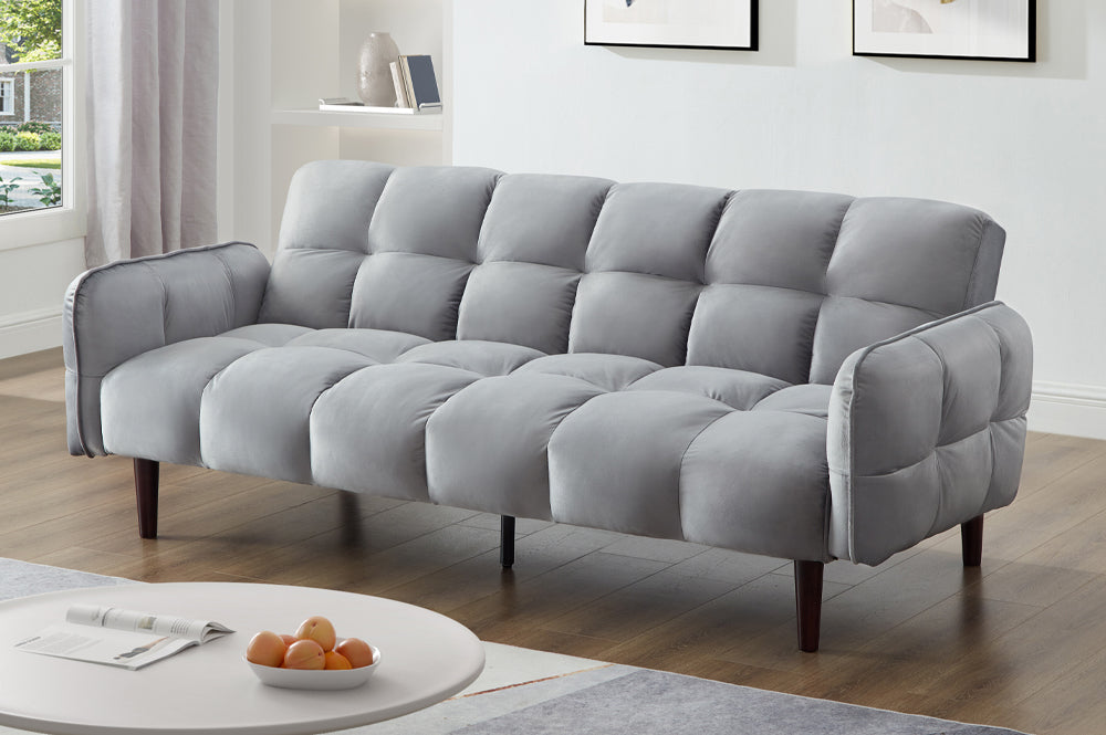 Light grey velvet klick klack sofa bed styled in a modern living room